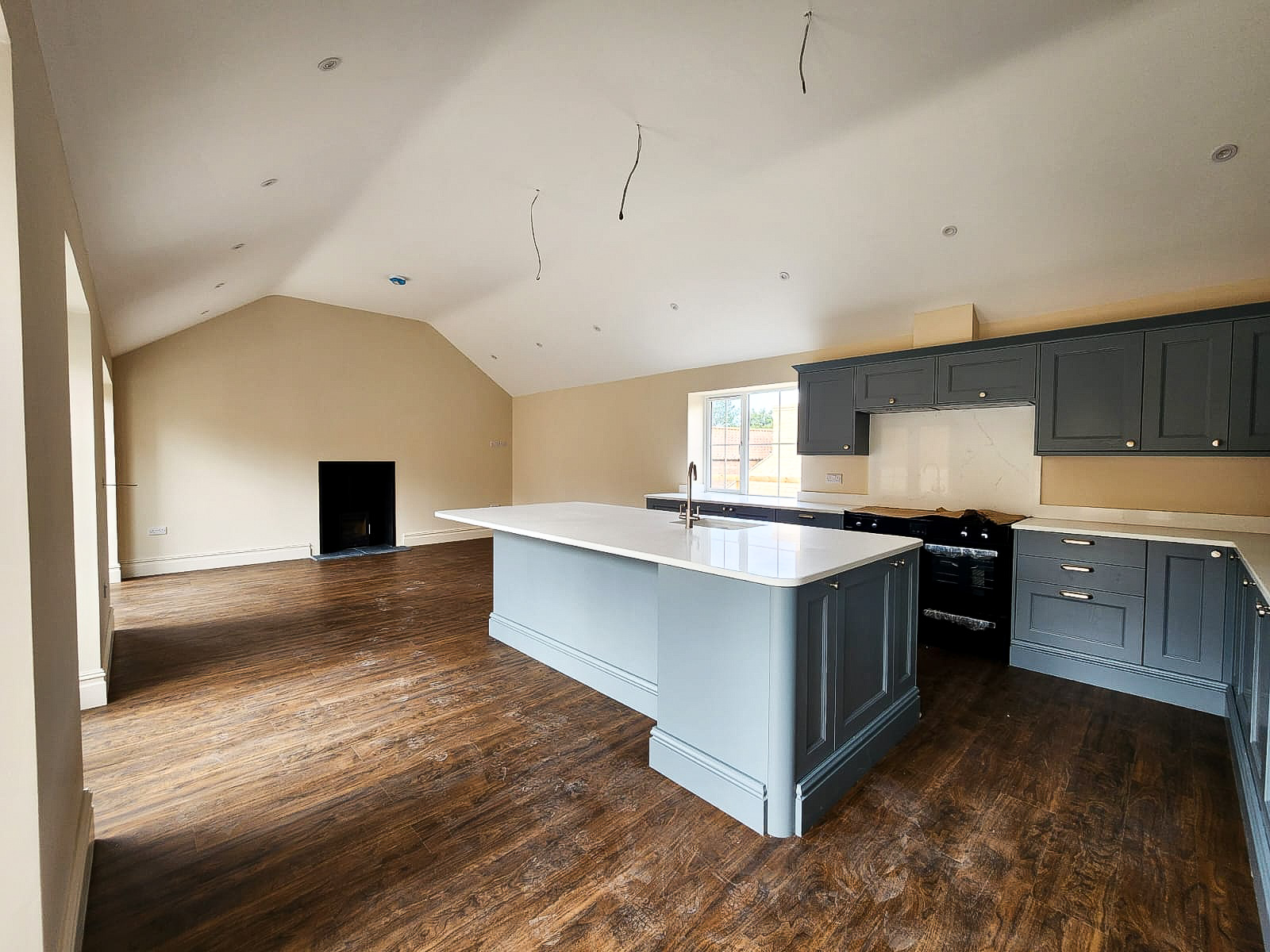 Open-plan kitchen with vaulted ceiling and structural alterations in Corby Glen